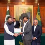receiving certificate of appreciation from Governor Punjab for my services as a Digital Marketing Trainer